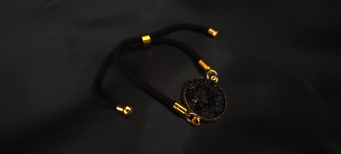 Simple bracelet Circle on the black string. Made of coal and stainless steel. Perfect gift for every man. Packed in gift packaging, a description of the coal from which the bracelet is made, is added as a gift.