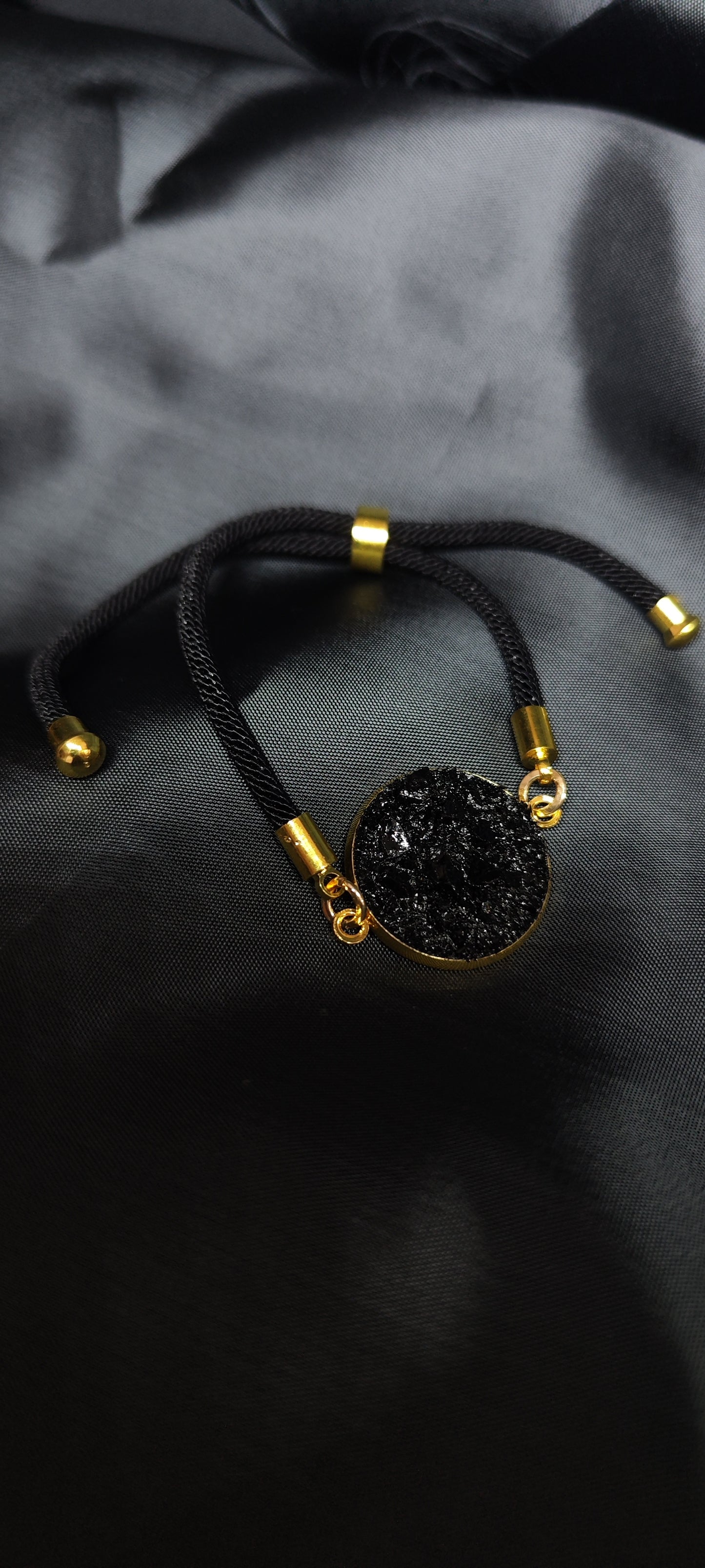 Simple bracelet Circle on the black string. Made of coal and stainless steel. Perfect gift for every man. Packed in gift packaging, a description of the coal from which the bracelet is made, is added as a gift.