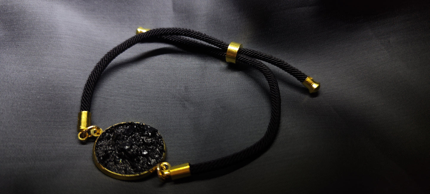 Simple bracelet Circle on the black string. Made of coal and stainless steel. Perfect gift for every man. Packed in gift packaging, a description of the coal from which the bracelet is made, is added as a gift.