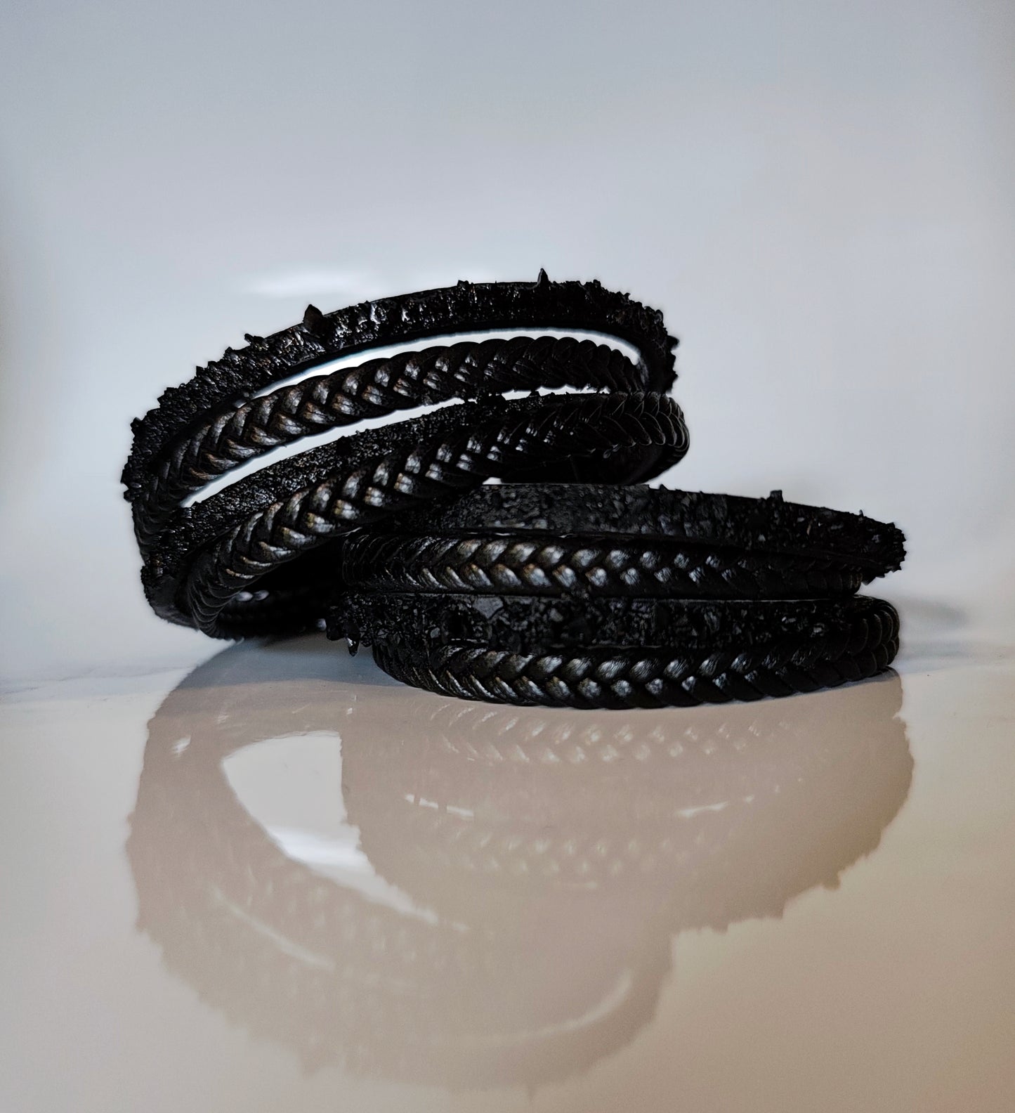 Leather Bracelet with Coal Accent
A refined blend of heritage and modern design. Handcrafted from premium leather, this bracelet features a unique weave of four straps and a symbolic element – natural Slovenian coal.
Available in two finishes:
🖤 Matte coal – for understated elegance
✨ High-gloss coal – for a bold, refined contrast
Details:
– Length: 18 cm
– Width: 2 cm
– Unisex: suitable for women and men
– Comes in a premium gift box
– Includes a story card about the coal's meaning and origin
