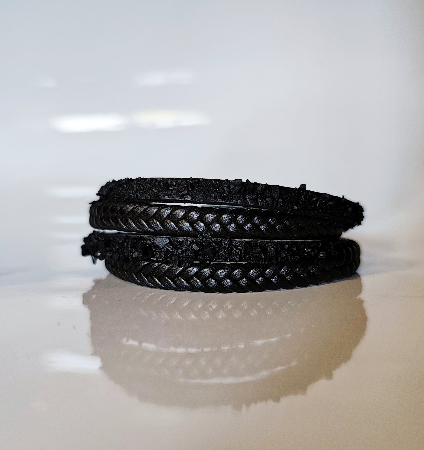 Leather Bracelet with Coal Accent
A refined blend of heritage and modern design. Handcrafted from premium leather, this bracelet features a unique weave of four straps and a symbolic element – natural Slovenian coal.
Available in two finishes:
🖤 Matte coal – for understated elegance
✨ High-gloss coal – for a bold, refined contrast
Details:
– Length: 18 cm
– Width: 2 cm
– Unisex: suitable for women and men
– Comes in a premium gift box
– Includes a story card about the coal's meaning and origin