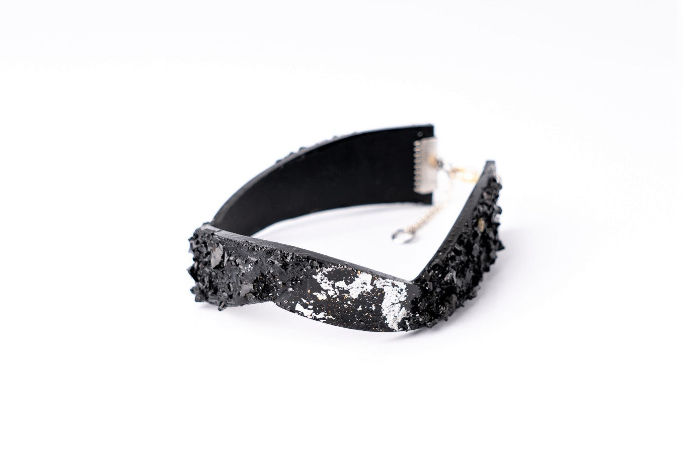 The KUOLMi Silver bracelet is made of 10 million-year-old coal. Due to its black luster and special organic shape, you will be noticed at all times. This bracelet will instantly upgrade your styling. A statement piece that combines edgy attitude and high fashion. You can choose a different style every day and upgrade it with this bracelet. You will rock them all- formal dress and high heels or something casual. This bracelet goes great with high heels, flip flops, and everything in between.