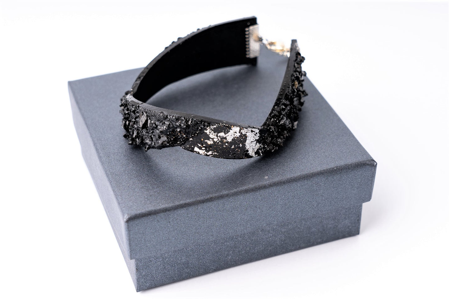 The KUOLMi Silver bracelet is made of 10 million-year-old coal. Due to its black luster and special organic shape, you will be noticed at all times. This bracelet will instantly upgrade your styling. A statement piece that combines edgy attitude and high fashion. You can choose a different style every day and upgrade it with this bracelet. You will rock them all- formal dress and high heels or something casual. This bracelet goes great with high heels, flip flops, and everything in between.