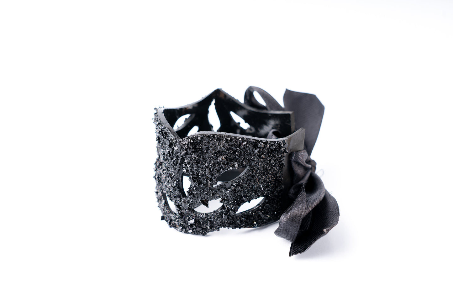 The KUOLMi Lace bracelet is made of 10 million-year-old stone. Due to its black luster and special organic shape, each piece is unique and unrepeatable in its appearance. It is made entirely by hand from coal and stainless steel. The size is adjustable. Jewelry is packaged in a gift box. The story about coal from which the bracelet was made is included as a gift. Mighty and powerful.