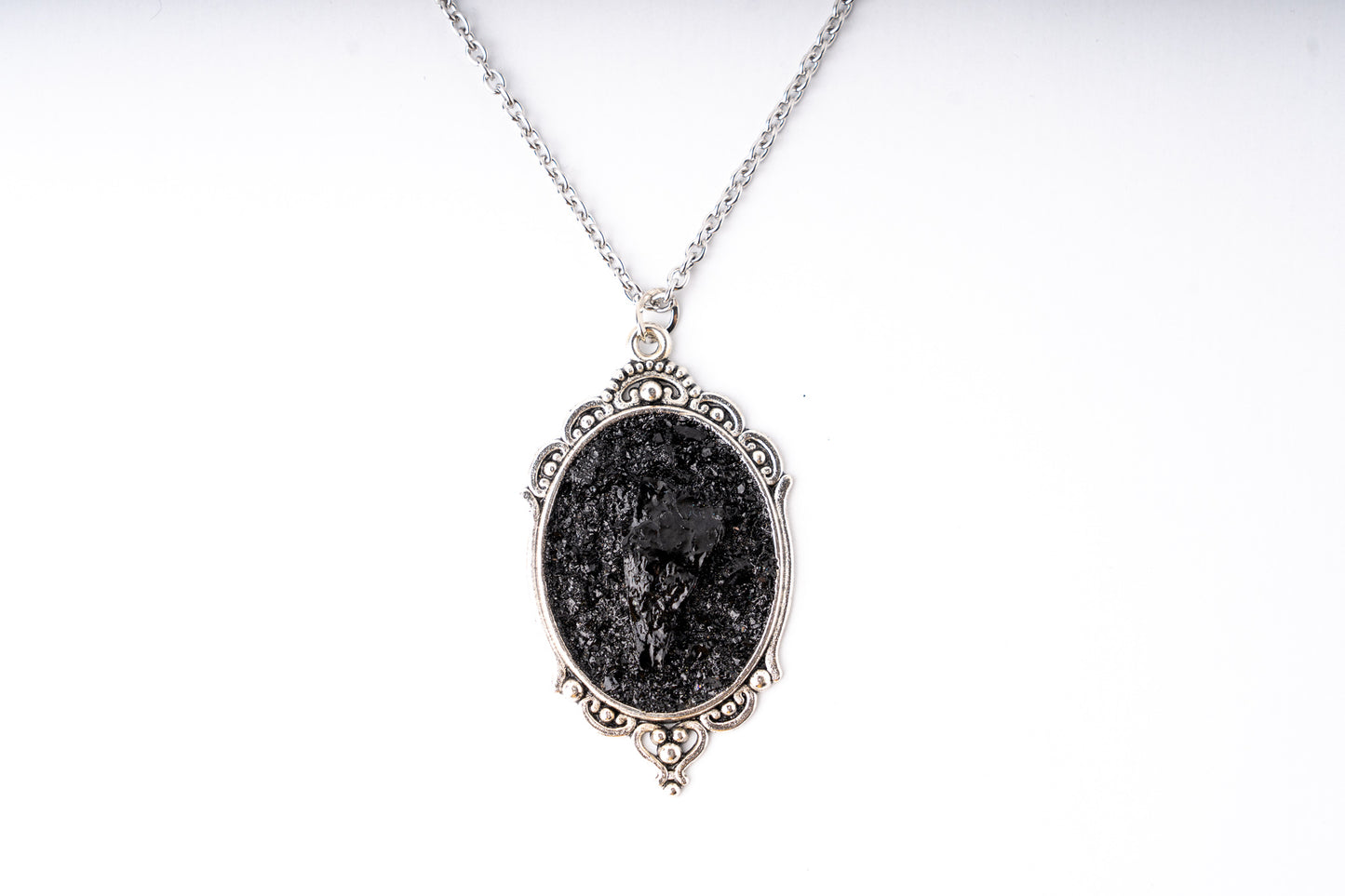 The KUOLMi Necklace is made of 10 million-year-old stone. Due to its black luster and special organic shape, each piece is unique and unrepeatable in its appearance. It is made entirely by hand from coal and stainless steel. The size is adjustable. The chain is 60 cm long with an extension. Jewelry is packaged in a gift box. The story about coal from which the bracelet was made is included as a gift. Mighty and powerful.