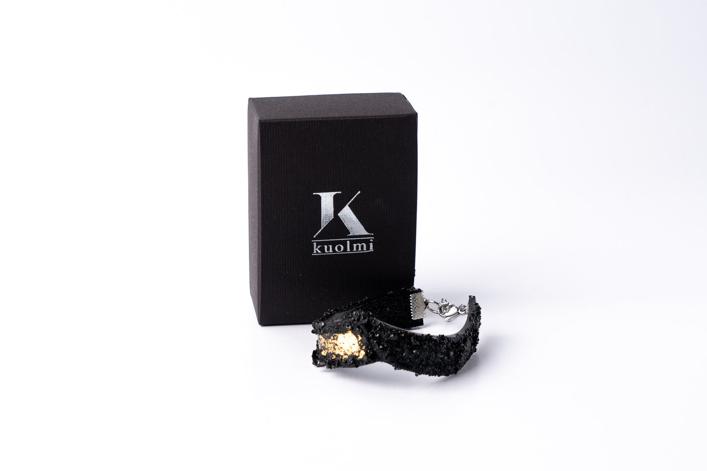 The KUOLMi Gold bracelet is made of 10 million-year-old coal. Due to its black luster and special organic shape, you will be noticed at all times. This bracelet will instantly upgrade your styling. A statement piece that combines edgy attitude and high fashion. You can choose a different style every day and upgrade it with this bracelet. You will rock them all- formal dress and high heels or something casual. This bracelet goes great with high heels, flip flops, and everything in between.