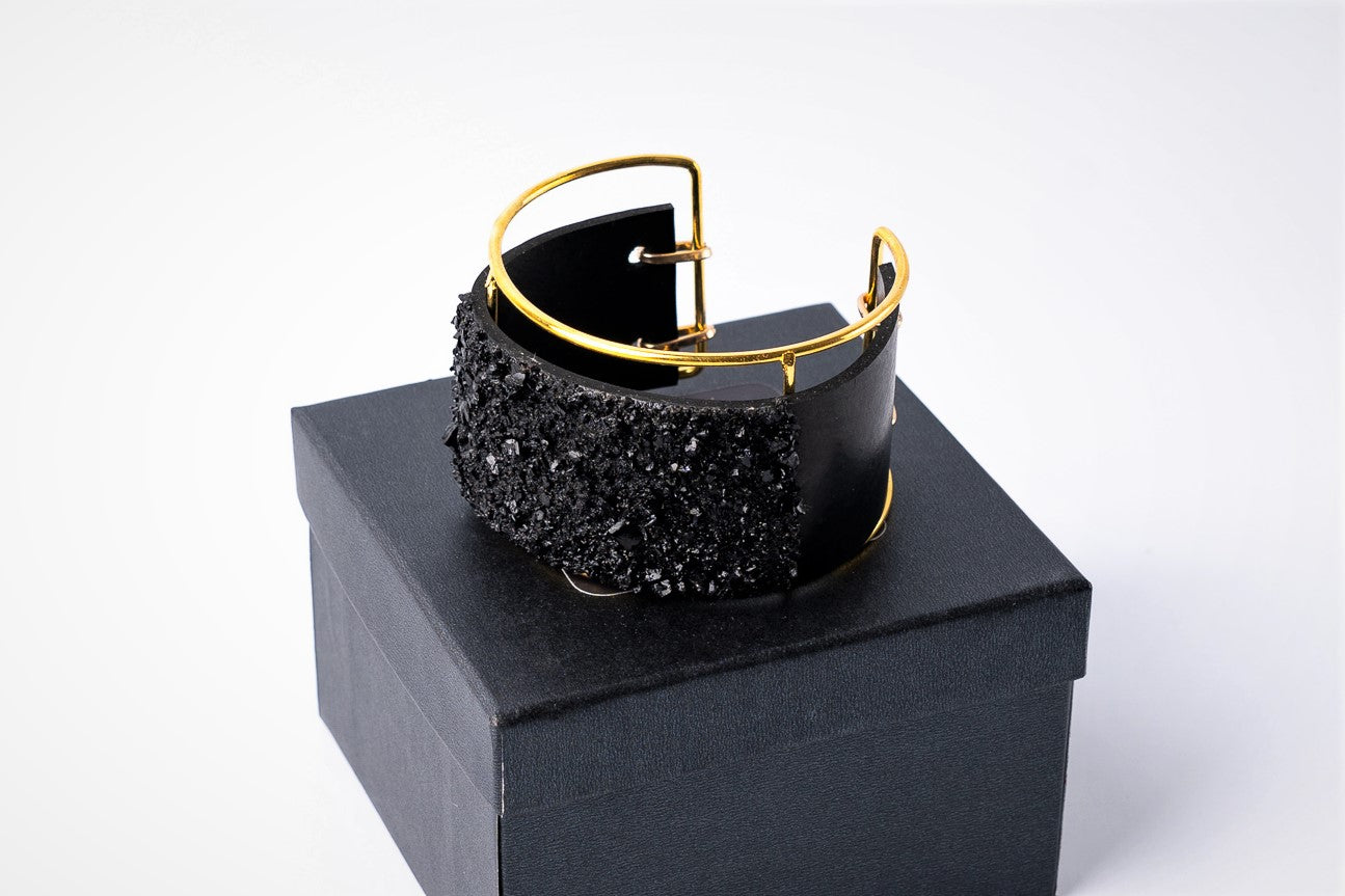 The KUOLMi XL bracelet is made of 10 million-year-old coal.  Due to its black luster and special organic shape, you will be noticed at all times. This bracelet will instantly upgrade your styling. A statement piece that combines edgy attitude and high fashion.  You can choose a different style every day and upgrade it with this bracelet. You will rock them all-  formal dress and high heels or something casual. This bracelet goes great with high heels, flip flops, and everything in between.
