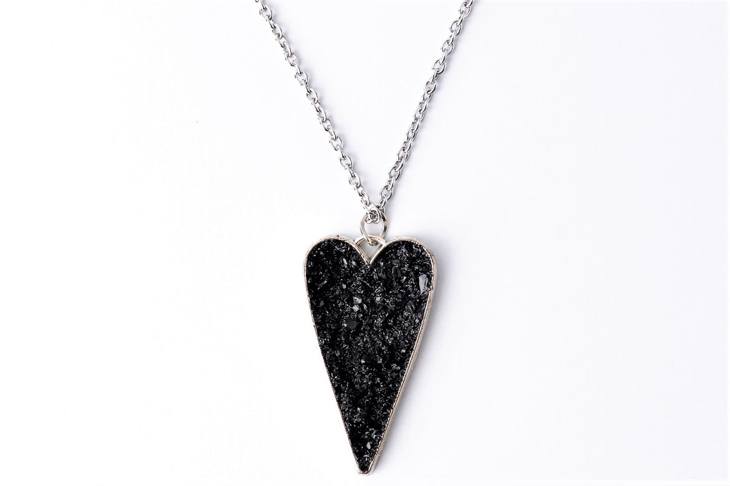 This awesome necklace is a mix of three styles: gentle timeless elegance, edgy steampunk, and classic rocker touch. It gives your outfit the right amount of emotions, elegance end edge. A perfect combination of heart softness, elegant stainless steel chains, and raw organically shaped natural coal… create a statement piece for various occasions.