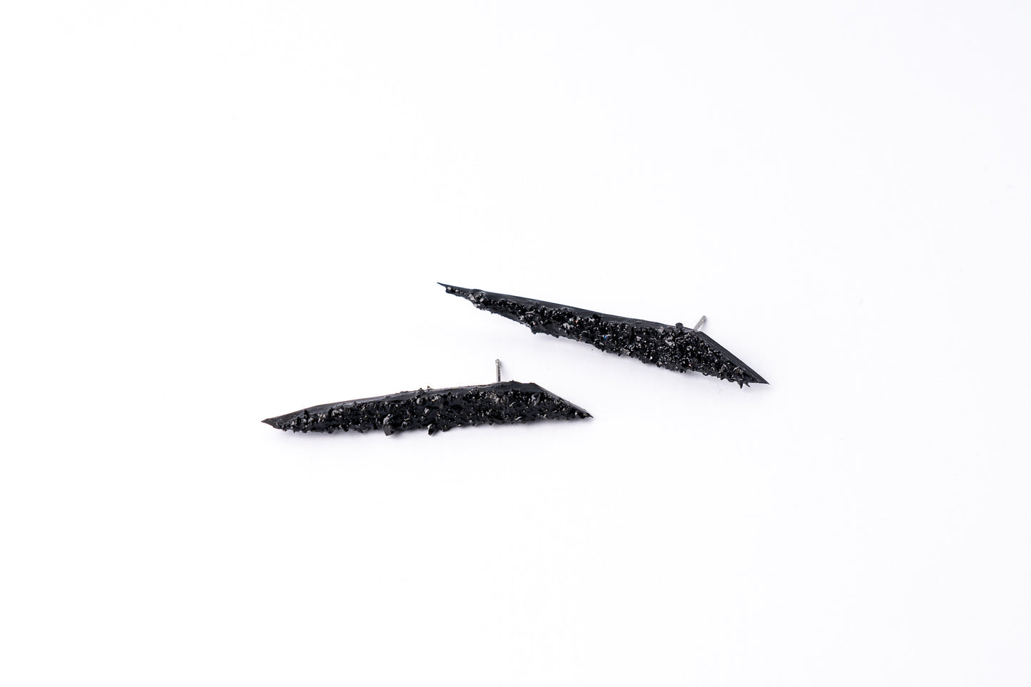 The Earrings KUOLMi Creation Style are made of 10 million-year-old stone. Due to its black luster and special organic shape, each piece is unique and unrepeatable in its appearance. It is made entirely by hand from coal and stainless steel. Jewelry is packaged in a gift box. The story about coal from which the jewelry was made is included as a gift. Simple. Elegant. Mighty and powerful.