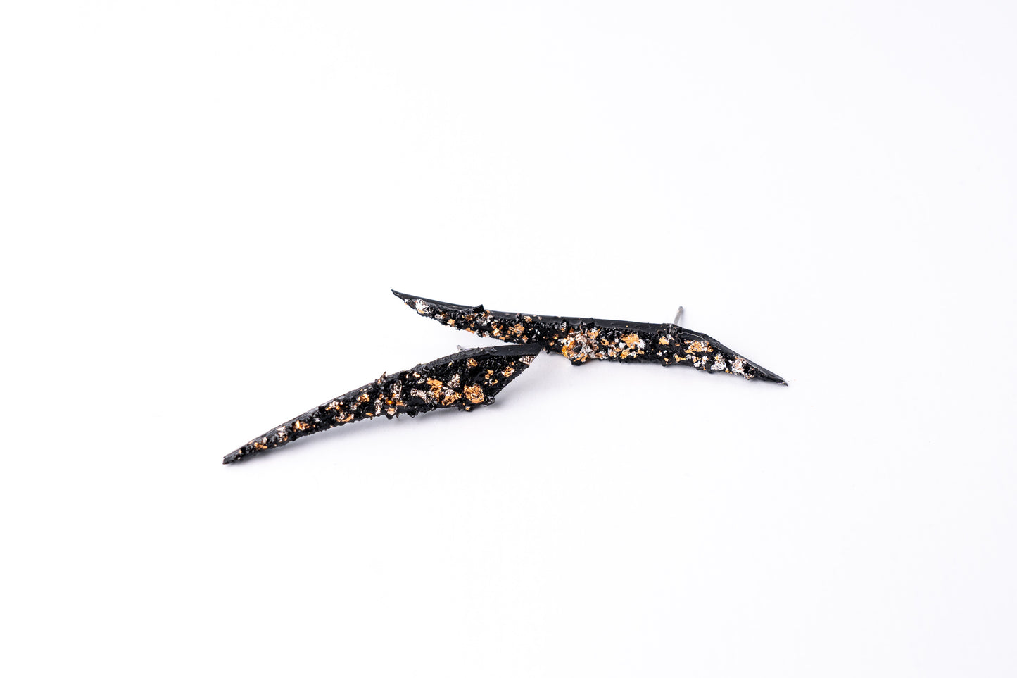 The Earrings KUOLMi Creation Style are made of 10 million-year-old stone. Due to its black luster and special organic shape, each piece is unique and unrepeatable in its appearance. It is made entirely by hand from coal and stainless steel. Jewelry is packaged in a gift box. The story about coal from which the jewelry was made is included as a gift. Simple. Elegant. Mighty and powerful.