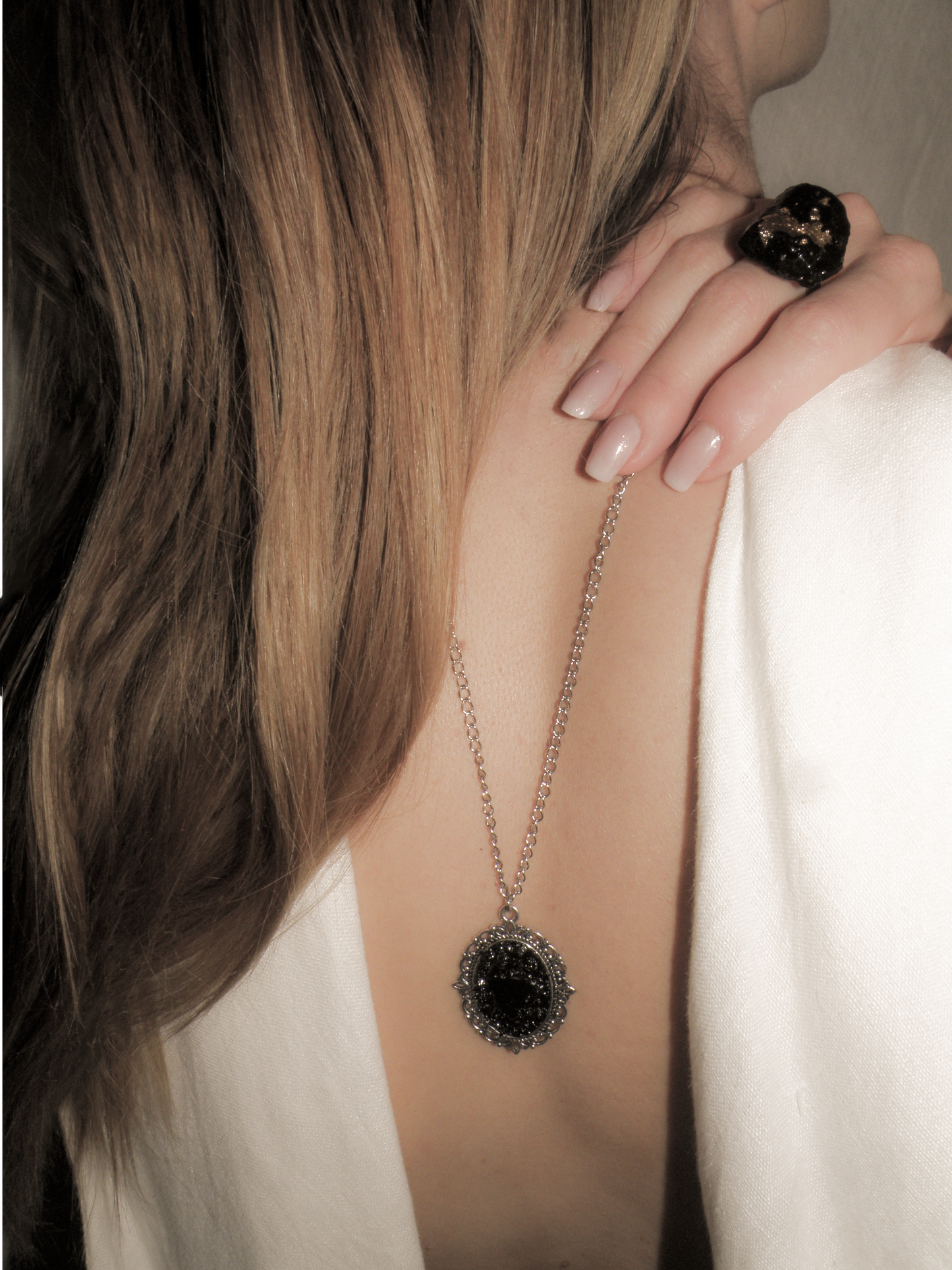 The KUOLMi Necklace is made of 10 million-year-old stone. Due to its black luster and special organic shape, each piece is unique and unrepeatable in its appearance. It is made entirely by hand from coal and stainless steel. The size is adjustable. Jewelry is packaged in a gift box. The story about coal from which the bracelet was made is included as a gift. Mighty and powerful.