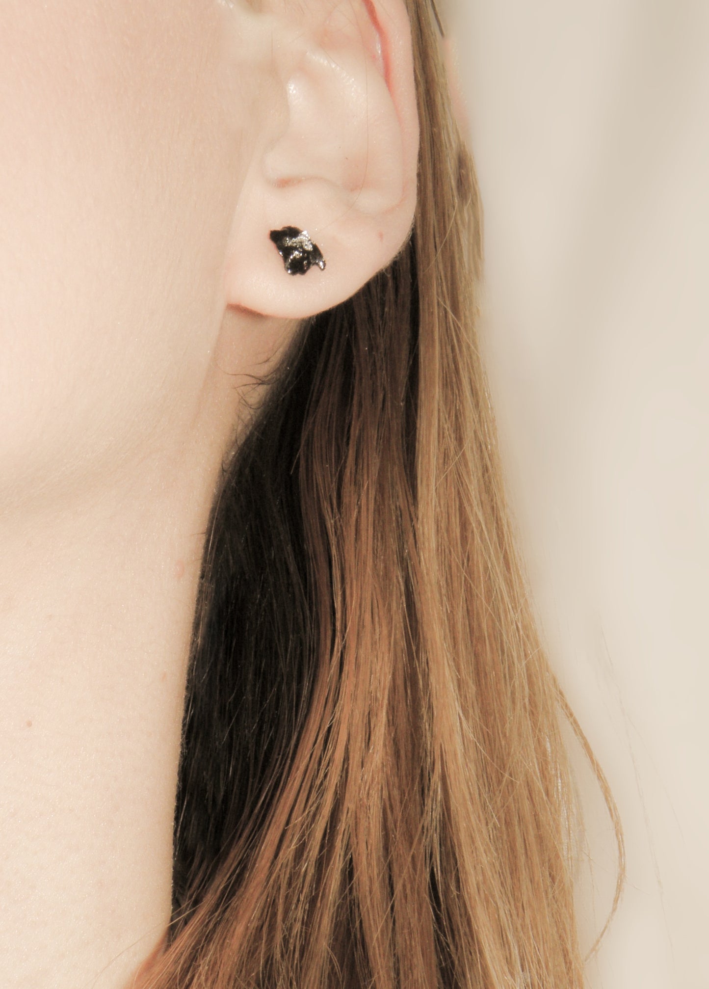 The Earrings KUOLMi Silver are made of 10 million-year-old stone. Due to its black luster and special organic shape, each piece is unique and unrepeatable in its appearance. It is made entirely by hand from coal and stainless steel. Jewelry is packaged in a gift box. The story about coal from which the bracelet was made is included as a gift. Simple. Elegant. Mighty and powerful.