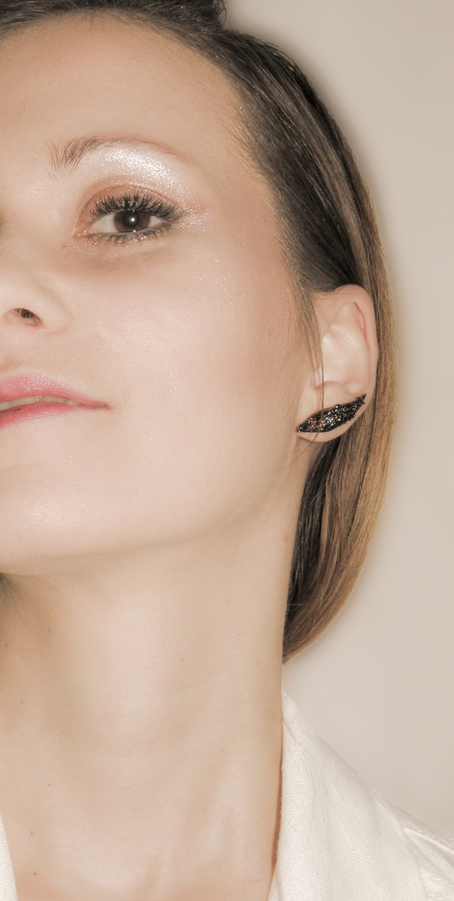 The Earrings KUOLMi Tears are made of 10 million-year-old stone. Due to its black luster and special organic shape, each piece is unique and unrepeatable in its appearance. It is made entirely by hand from coal and stainless steel. Jewelry is packaged in a gift box. The story about coal from which the jewelry was made is included as a gift. Simple. Elegant. Mighty and powerful.
