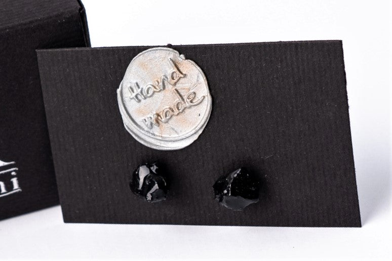This one of a kind unique organic coal earrings instantly make your outfit pop out. You are going to fall in love with this gorgeous and comfortable pair the first time you wear it. The 10 million-year-old stone will shine on you with all its brilliance. The earrings are made of coal and stainless steel. The image is symbolic because each piece is handmade, unrepeatable, and unique. The earrings are packaged in gift packaging with an added description of the coal story.