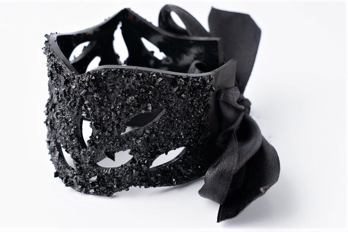 The KUOLMi Lace bracelet is made of 10 million-year-old coal. Due to its black luster and special organic shape, you will be noticed at all times. This bracelet will instantly upgrade your styling. A statement piece that combines edgy attitude and high fashion. You can choose a different style every day and upgrade it with this bracelet. You will rock them all- formal dress and high heels or something casual. This bracelet goes great with high heels, flip flops, and everything in between.