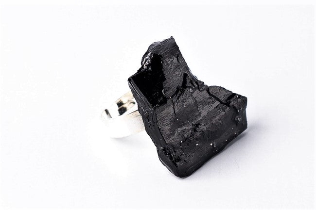 The 10 million-year-old stone will shine on your hand with all its brilliance. The ring is made of coal and stainless steel. This statement piece combines an edgy attitude and fashion. It is comfortable to wear and very durable at the same time. Try to wear it with various stylings, from casual to edgy. This ring brings elegance and a classy feel to any wardrobe.
