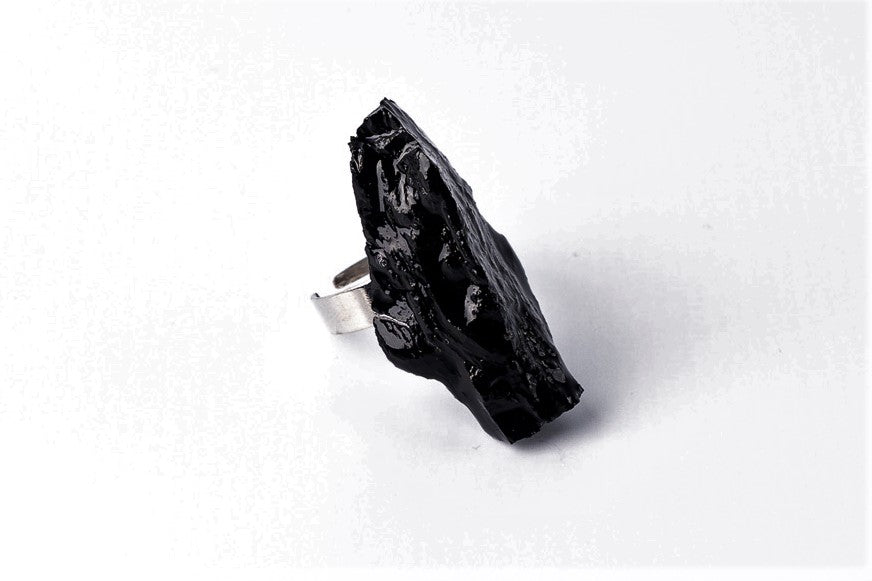 The 10 million-year-old stone will shine on your hand with all its brilliance. The ring is made of coal and stainless steel. This statement piece combines an edgy attitude and fashion. It is comfortable to wear and very durable at the same time. Try to wear it with various stylings, from casual to edgy. This ring brings elegance and a classy feel to any wardrobe.