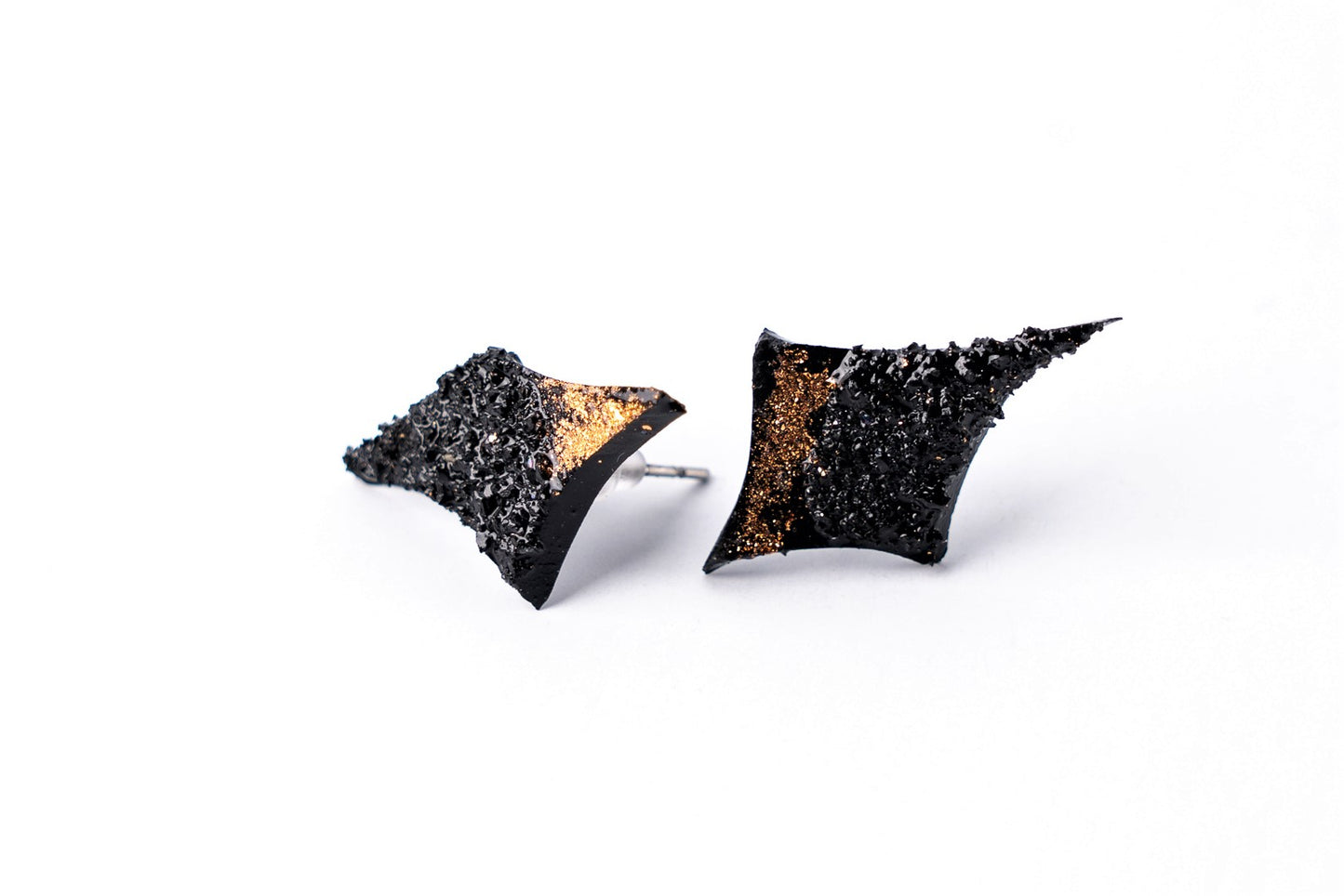 This one of a kind unique star-shaped coal earrings instantly make your outfit pop out. You are going to fall in love with this gorgeous and comfortable pair the first time you wear it. The 10 million-year-old stone will shine on you with all its brilliance. The earrings are made of coal and stainless steel. The image is symbolic because each piece is handmade, unrepeatable, and unique.