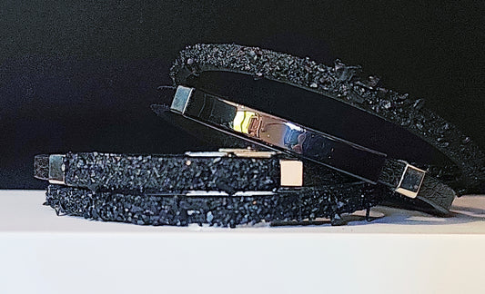 Leather Bracelet with Coal Accent
A refined blend of heritage and modern design. Handcrafted from premium leather, this bracelet features a unique weave of four straps and a symbolic element – natural Slovenian coal.

Available in two finishes:
🖤 Matte coal – for understated elegance
✨ High-gloss coal – for a bold, refined contrast

Details:
– Length: 22 cm
– Width: 2 cm
– Unisex: suitable for women and men
– Comes in a premium gift box
– Includes a story card about the coal's meaning and origin
