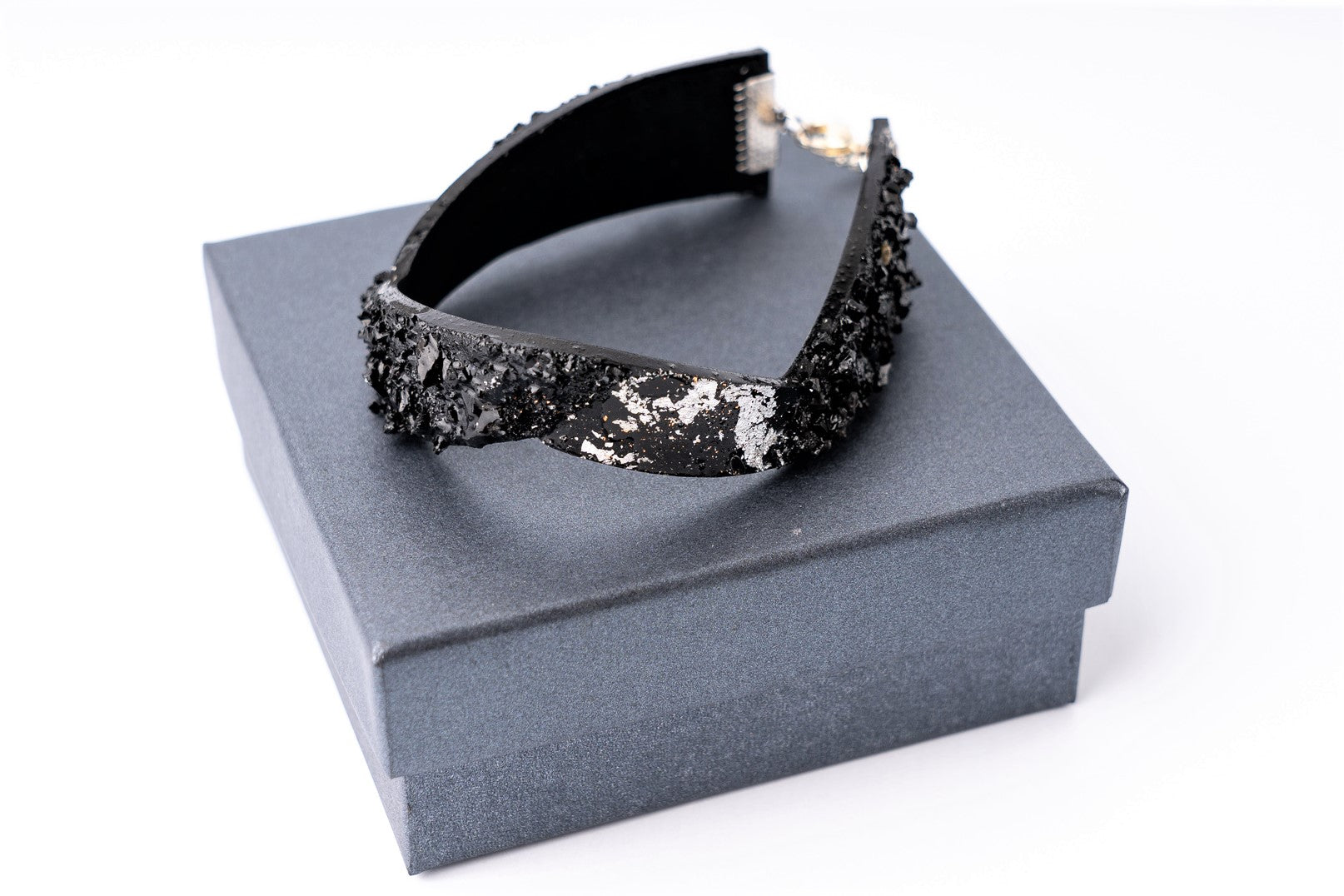 The KUOLMi Silver bracelet is made of 10 million-year-old coal.  Due to its black luster and special organic shape, you will be noticed at all times. This bracelet will instantly upgrade your styling. A statement piece that combines edgy attitude and high fashion.  You can choose a different style every day and upgrade it with this bracelet. You will rock them all-  formal dress and high heels or something casual. This bracelet goes great with high heels, flip flops, and everything in between.