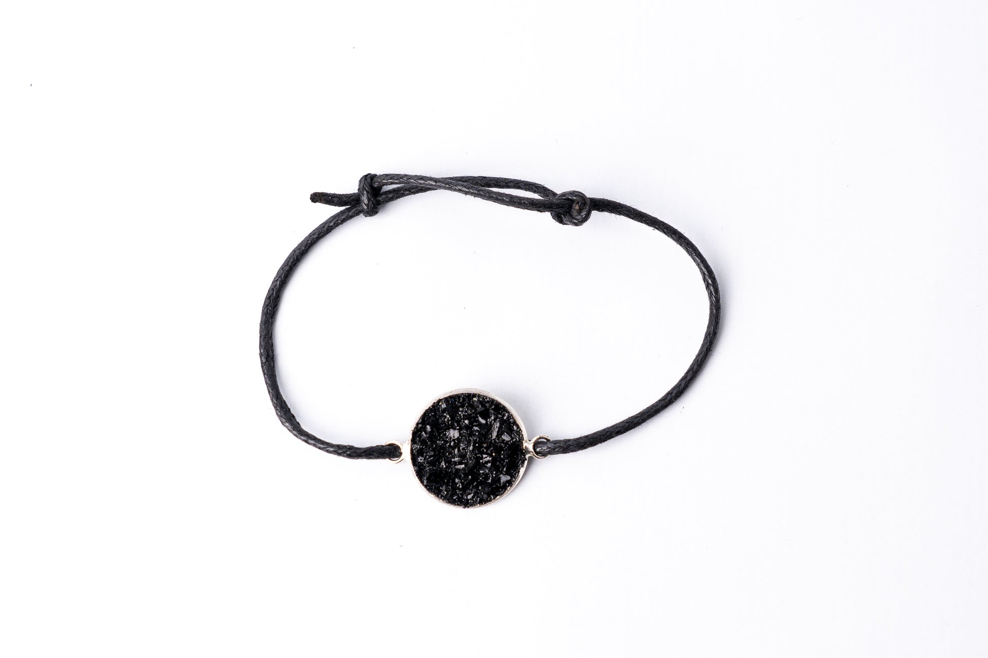 Simple bracelet Circle on the black string.  Made of coal and stainless steel.   Perfect gift for every man. Packed in gift packaging, a description of the coal from which the bracelet is made, is added as a gift.