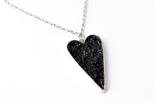 This awesome necklace is a mix of three styles: gentle timeless elegance, edgy steampunk, and classic rocker touch. It gives your outfit the right amount of emotions, elegance end edge. A perfect combination of heart softness, elegant stainless steel chains, and raw organically shaped natural coal… create a statement piece for various occasions.