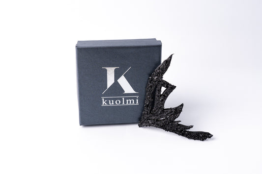 The KUOLMi handmade brooch is a fantastic accessory that makes the look perfect. The 10 million-year-old stone will shine on you with all its brilliance. The brooch is made of coal and stainless steel. The image is symbolic because each piece is handmade, unrepeatable, and unique. It is really light to wear.  The brooch is packaged in gift packaging with an added description of the coal story.