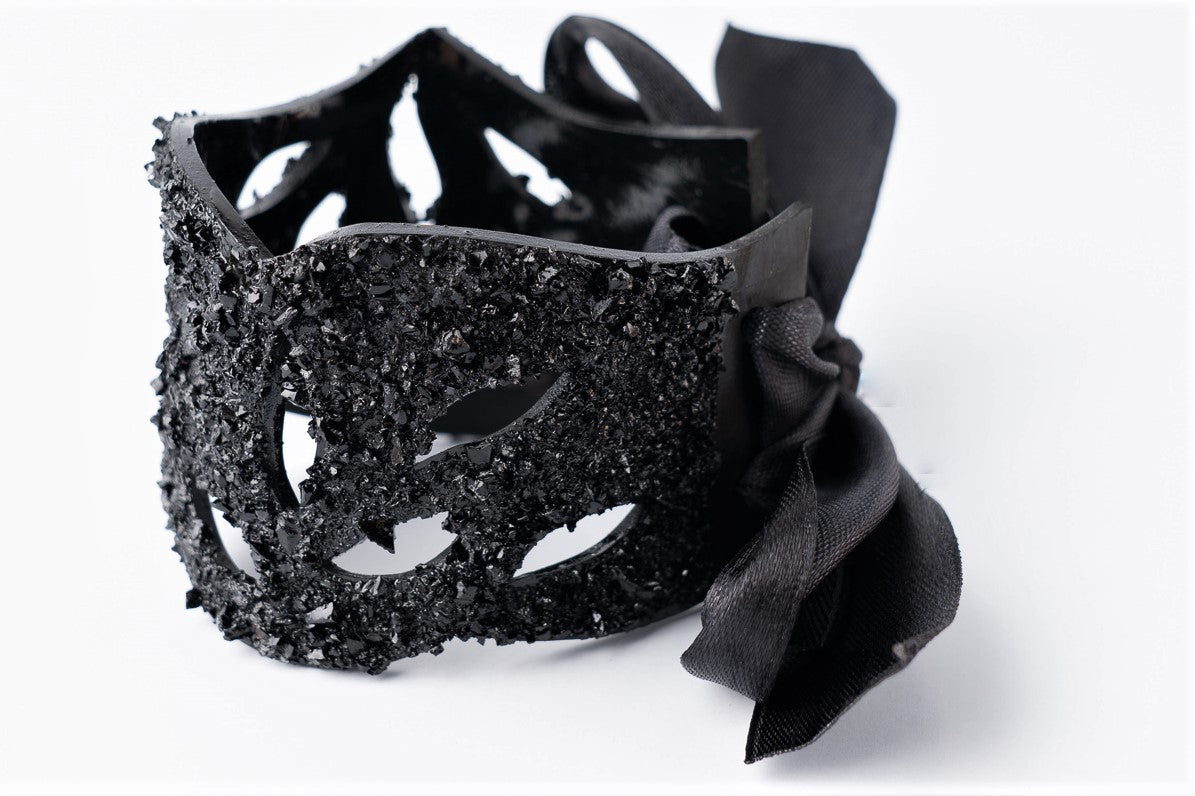 The KUOLMi Lace bracelet is made of 10 million-year-old coal.  Due to its black luster and special organic shape, you will be noticed at all times. This bracelet will instantly upgrade your styling. A statement piece that combines edgy attitude and high fashion.  You can choose a different style every day and upgrade it with this bracelet. You will rock them all-  formal dress and high heels or something casual. This bracelet goes great with high heels, flip flops, and everything in between.