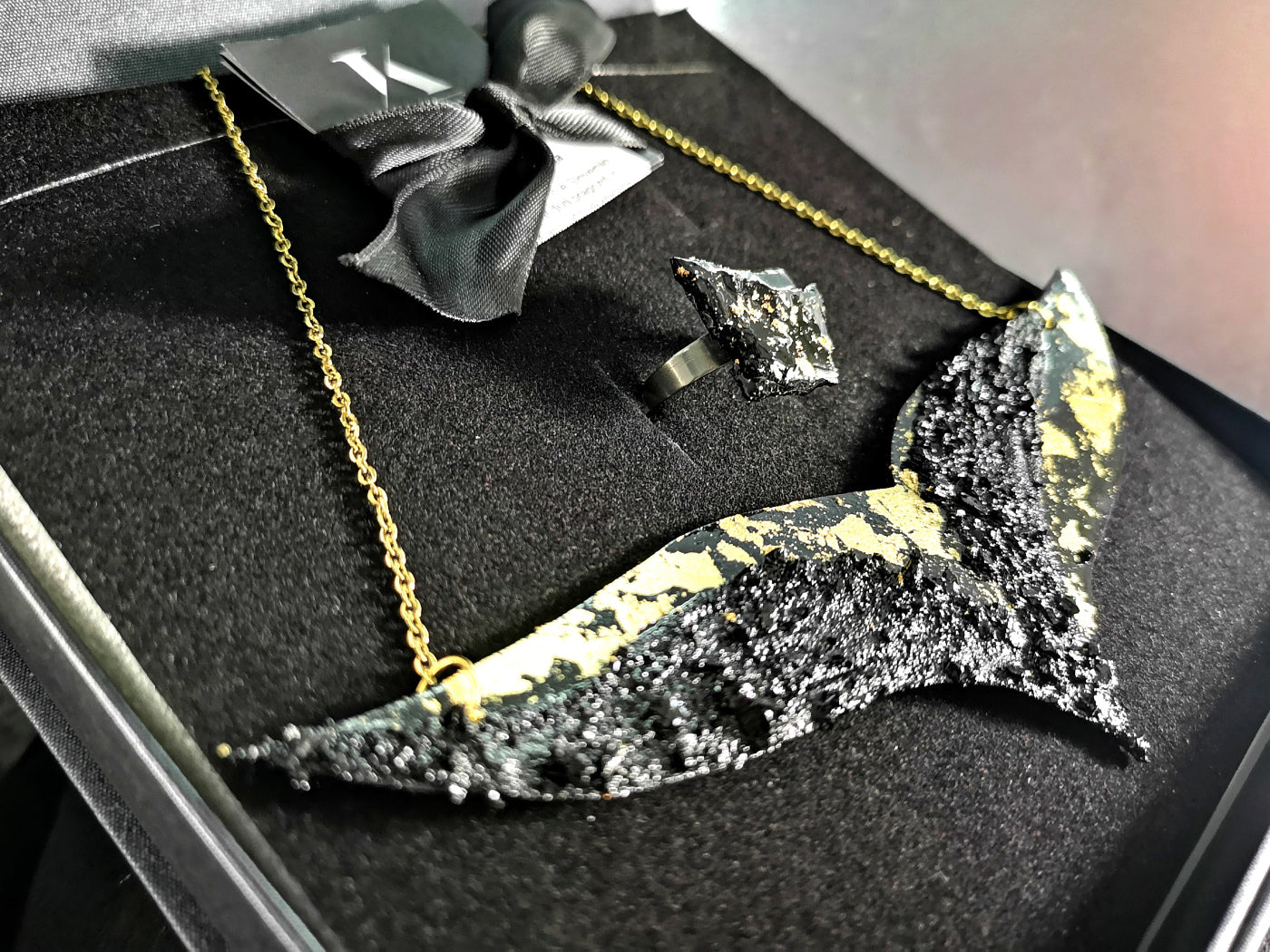 The KUOLMi Necklace is made of 10 million-year-old stone. Due to its black luster and special organic shape, each piece is unique and unrepeatable in its appearance. It is made entirely by hand from coal and stainless steel. The size is adjustable. Jewelry is packaged in a gift box. The story about coal from which the bracelet was made is included as a gift.    Mighty and powerful.