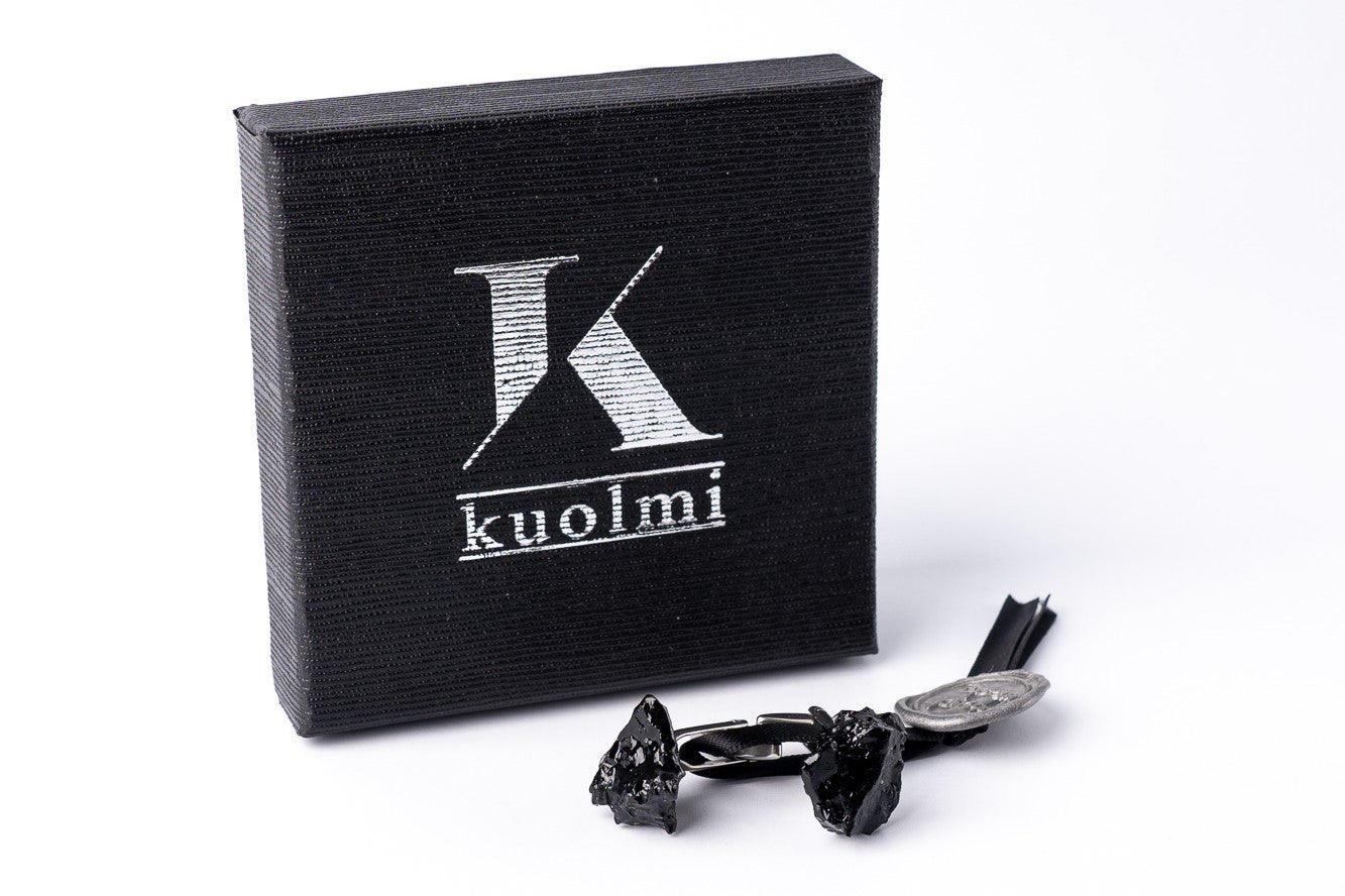 KUOLMI cuff links are made with real coal in combination with stainless steel.  The 10 million-year-old stone will shine on his hand with all its brilliance.  The image is symbolic because each piece is handmade, unrepeatable, and unique. The cufflinks were packaged in gift packaging with an added description of the coal story.  Perfect FOR HIM.