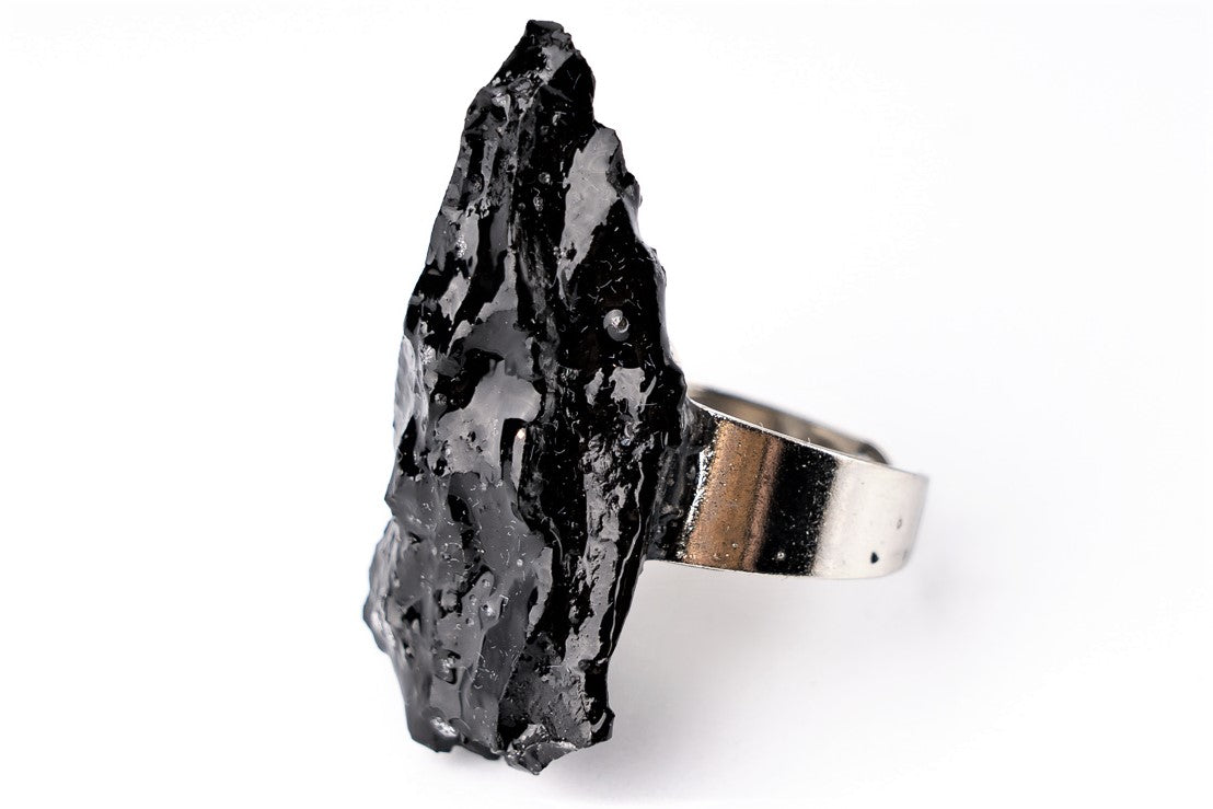 The 10 million-year-old stone will shine on your hand with all its brilliance. The ring is made of coal and stainless steel.  This statement piece combines an edgy attitude and fashion. It is comfortable to wear and very durable at the same time. Try to wear it with various stylings, from casual to edgy. This ring brings elegance and a classy feel to any wardrobe.