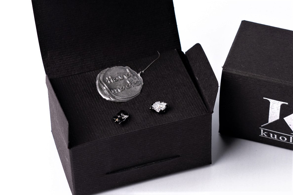 The 10 million-year-old stone will shine on you with all its brilliance. The earrings are made of coal and stainless steel. The image is symbolic because each piece is handmade, unrepeatable, and unique. The earrings are packaged in gift packaging with an added description of the coal story. Enjoy the richness of this statement piece of jewelry.